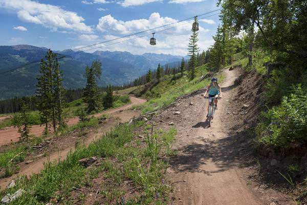 woman mountain biking