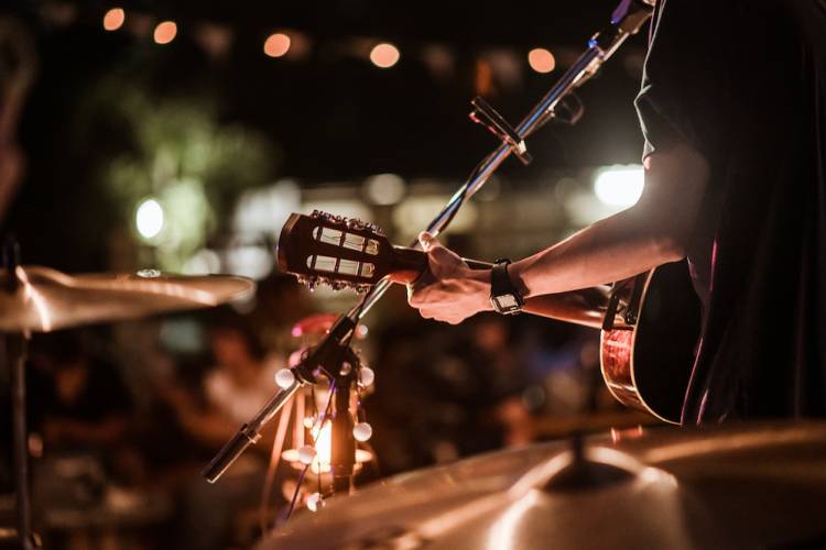 Man playing guitar on a stage