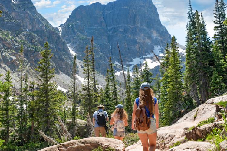 Three people hiking in Colorado in summertime