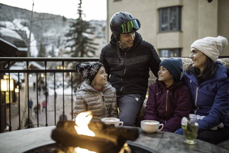 Family in Beaver Creek Winter Day around Firepit
