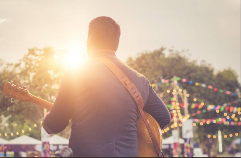 man playing music at an event