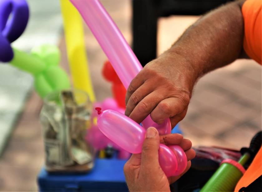 man making balloon figures 