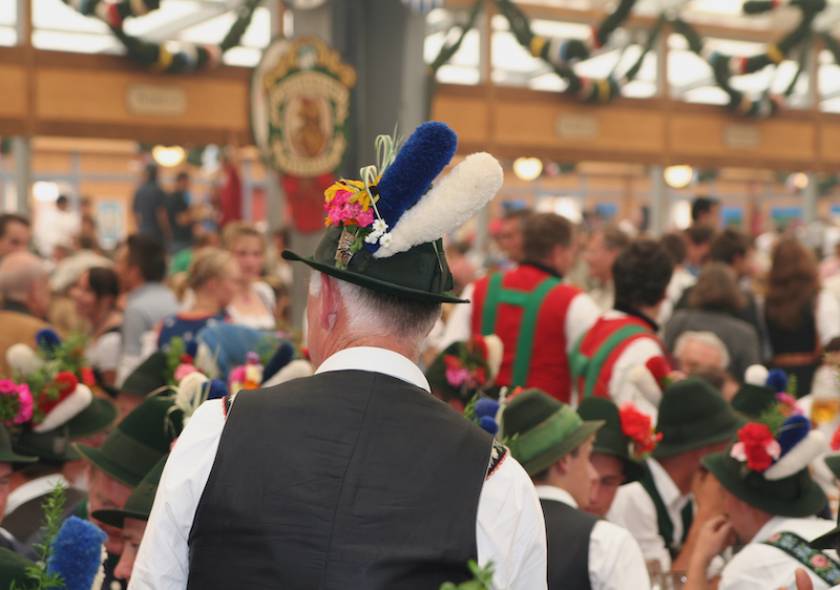 Celebration at the Oktoberfest inside a bavarian tent 