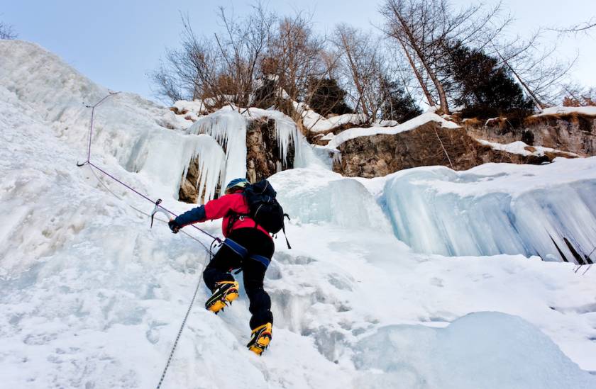 person ice climbing