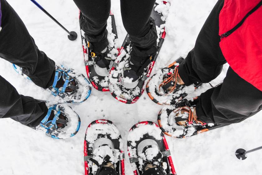 family in snowshoes view of feet